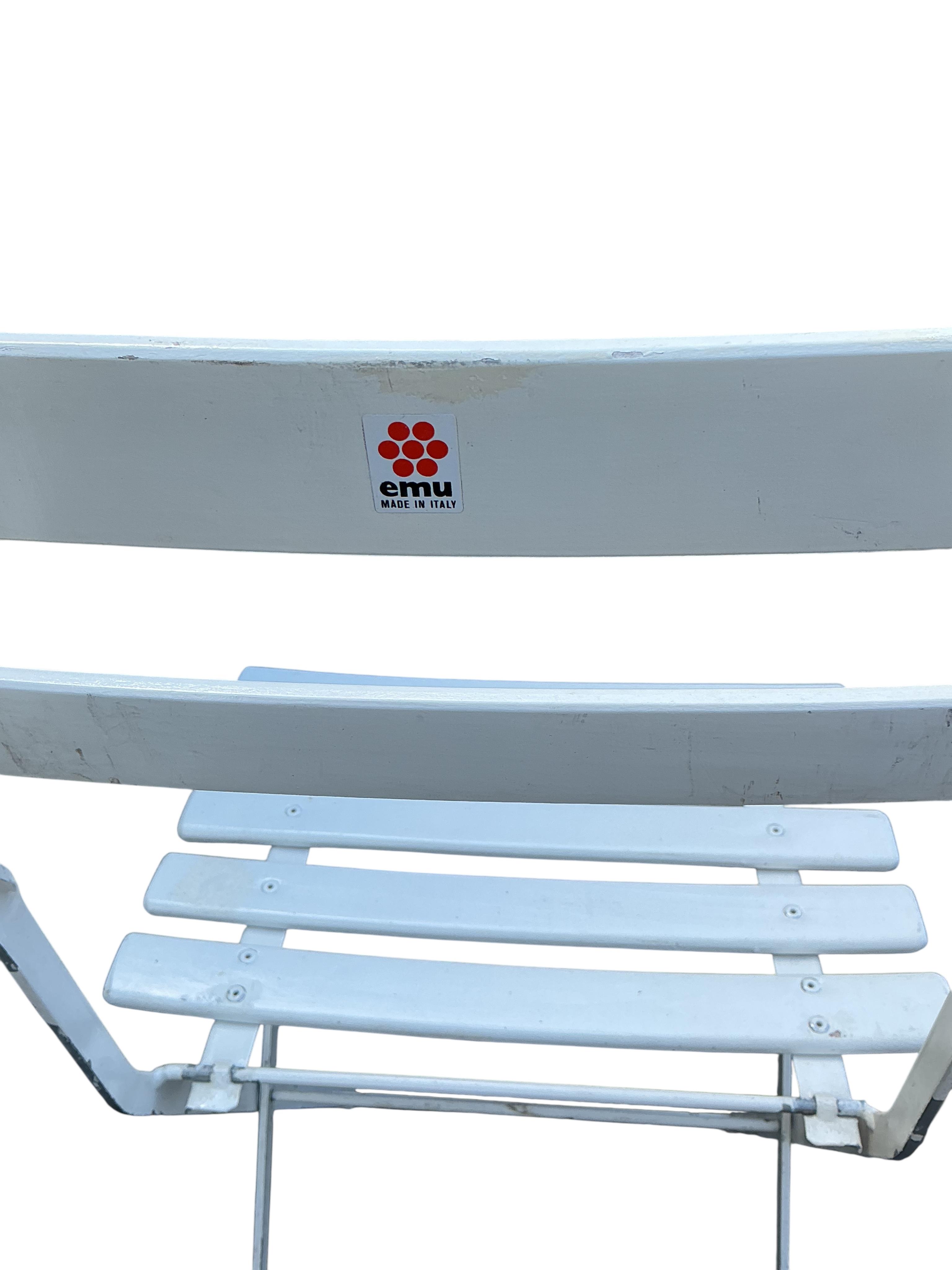 A set of four Emu (Italian) painted metal folding garden chairs